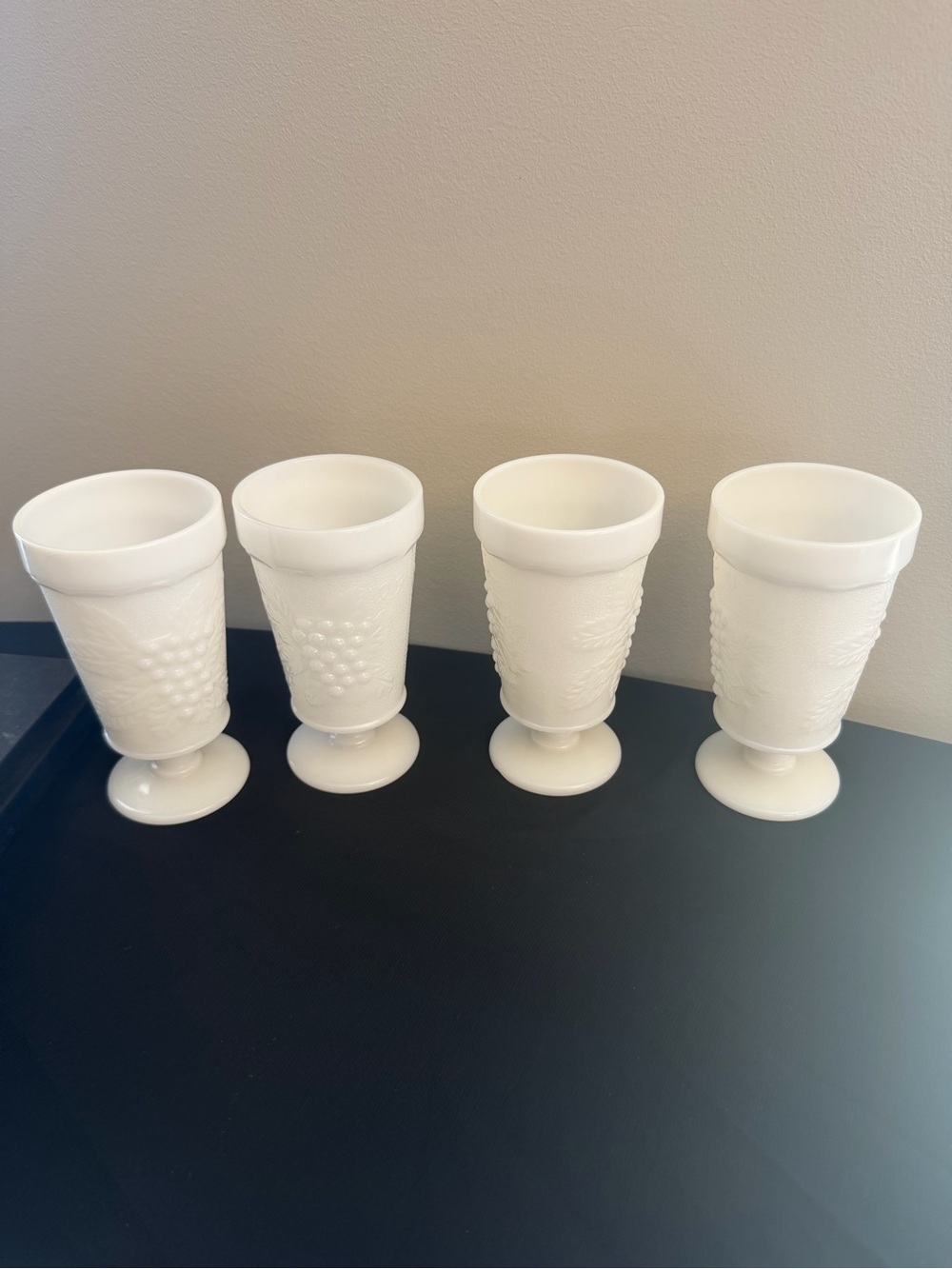 Vintage footed milk glass goblet cups with grapes and vine design
